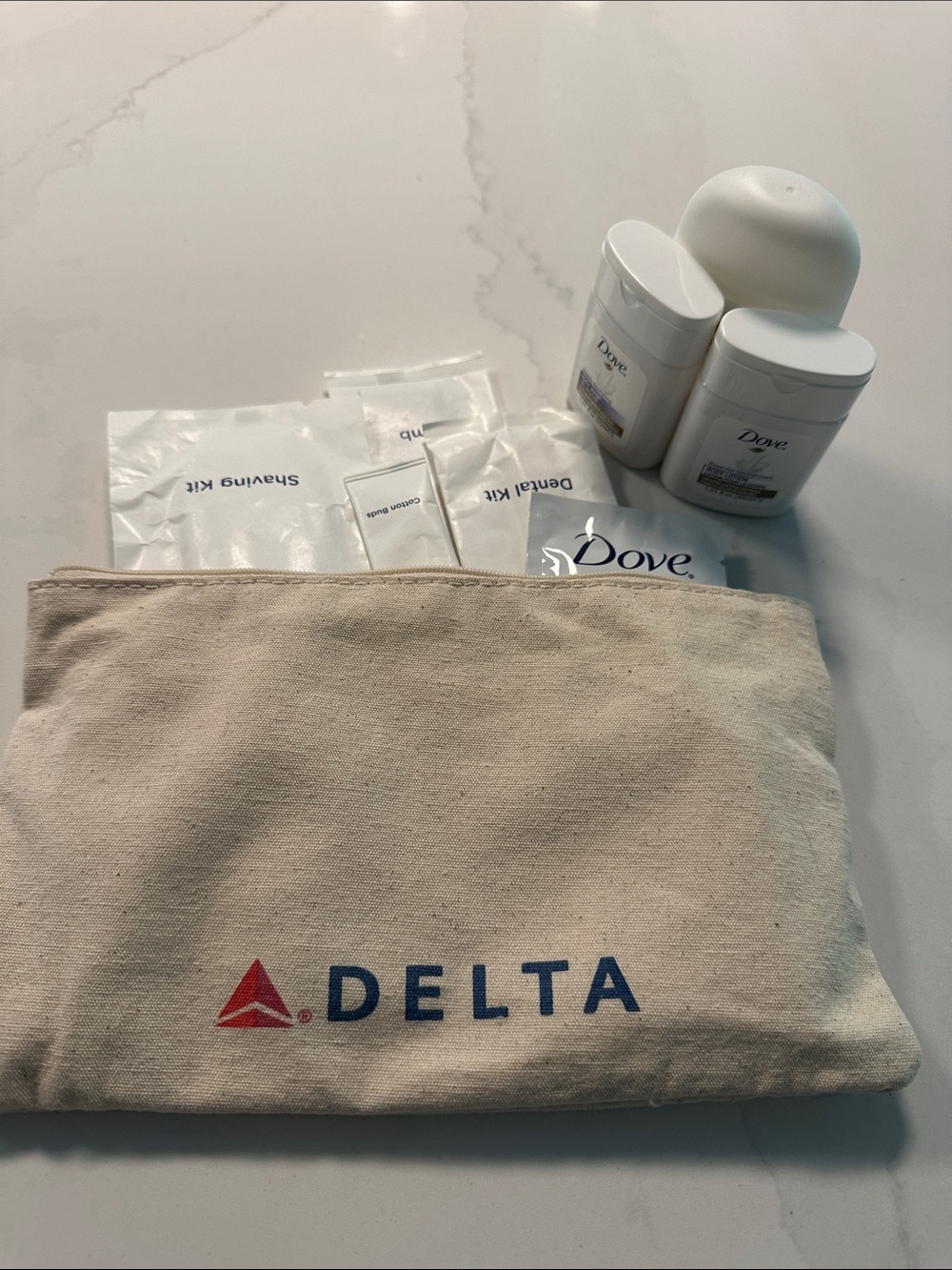 NWOT- Delta Travel Amenity Pouch with Toiletries in Beige and Red/Blue Logo